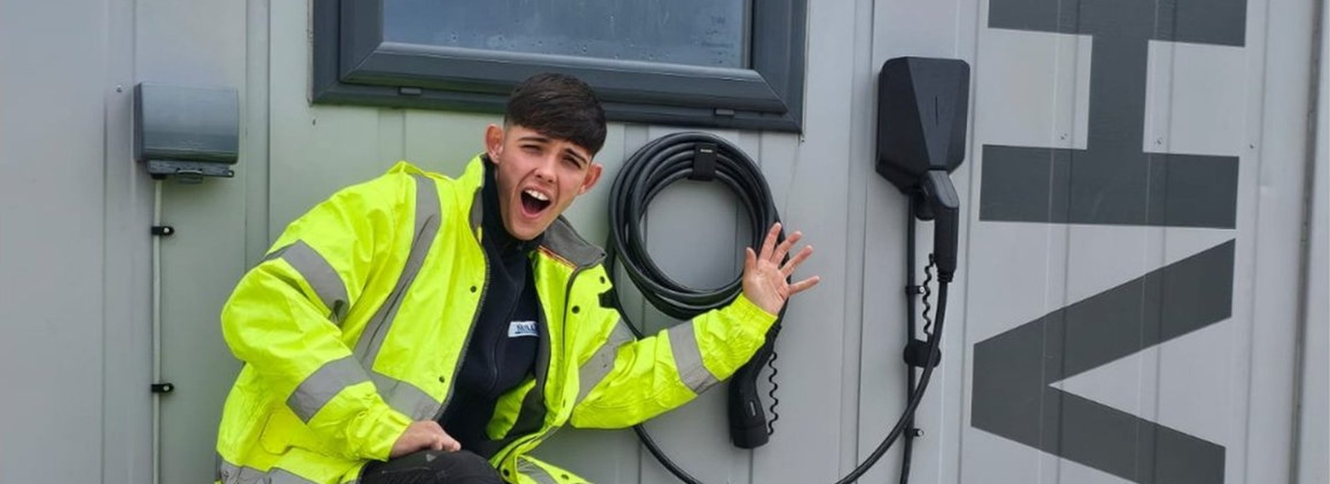Millar Electrics apprentice electrician with EV charging point installation, Ayrshire
